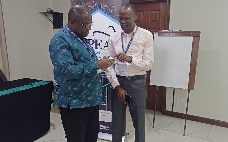 Nupea CEO Justus Wabuyabo and nuclear energy infrastructure development director Erick Ohaga at Mnarani Beach Club on Wednesday.