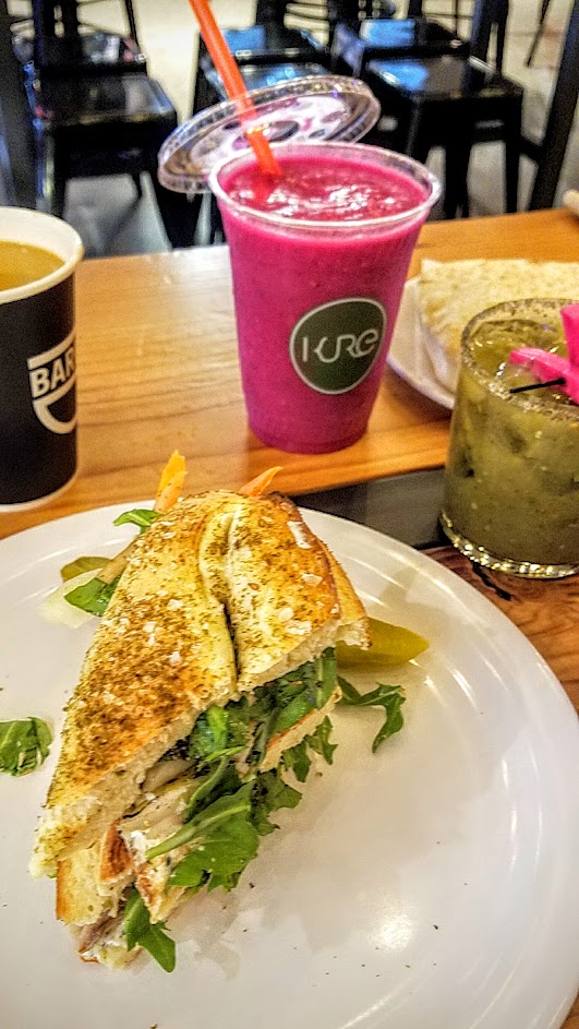 Shalom Y'all options for brunch at Pine Street Market of a Jerusalem Bagel Sandwich with house-smoked mackerel, pickles, za’atar, and herbed labneh, with beverages here from Barista, Kure, and the Shalom Mary