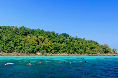 Snorkel in crystal clear water in the Surin archipelago