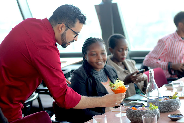 Chef Kinyo serves guests