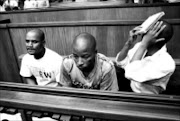 IN THE DOCK: The three men accused of killing reggae singer Lucky Dube appeared in the Johannesburg high court yesterday. They are, from left, Sifiso Mhlangu, Julius Gxowa and Mbuti Mabe.  04/02/2009. Pic. Weurkes  Beukes.  © SAPA