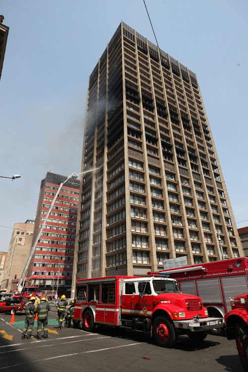 The burning Bank of Lisbon building in Johannesburg in which three firefighters died. File photo