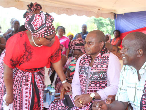 Pwani Movement founder Naomi Cidi with Kilifi Governor Amason Kingi and Kilifi North MP Gideon Mung’aro during a Maendeleo Ya Wanawake fundraiser at Kilifi Primary School on December 22, 2015 /JOHN CHESOLI