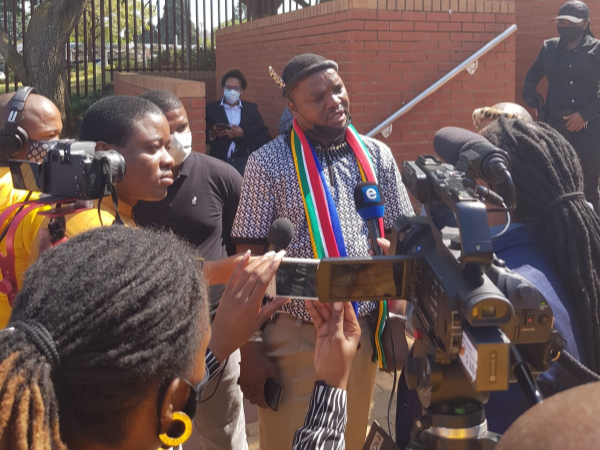 Former Ukhozi FM DJ Ngizwe Mchunu professing his innocence outside court.