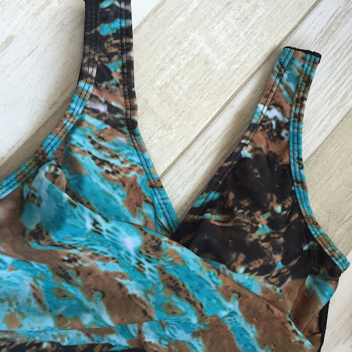 Title 5, Womens one-piece holiday swimsuit. Enjoy sun a...