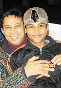 The correctional services department says it will look into the decision to release one of the men involved in the murder of musician Taliep Petersen, pictured left. 