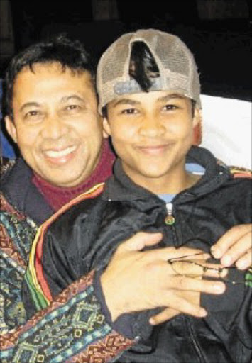 The correctional services department says it will look into the decision to release one of the men involved in the murder of musician Taliep Petersen, pictured left.