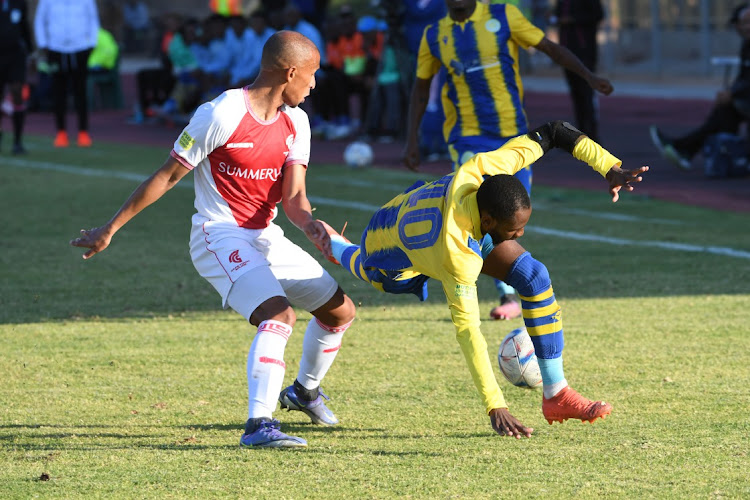 Kgomotso Mosadi of Casric FC tackled by Nazeer Allie of Cape Town Spurs during the PSL promotion playoff match between Casric Stars and Cape Town Spurs at Solomon Mahlangu Stadium on May 28, 2023 in KwaMhlanga, South Africa.