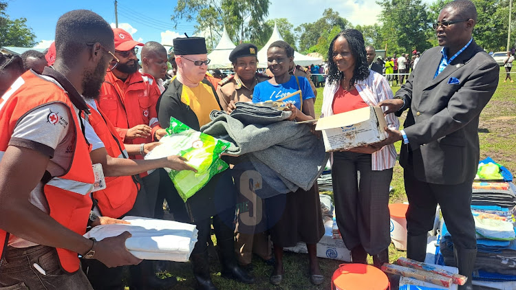 Government Spokesperson Isaac Mwauru during distribution of non-food items to displaced families at Nduru, Kabonyo Kanyagwal in Nyando, Kisumu county on May 7, 2024