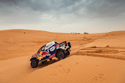 Nasser al-Attiyah and navigator Mathieu Baumel blast through the dunes en route to a stage eight victory.