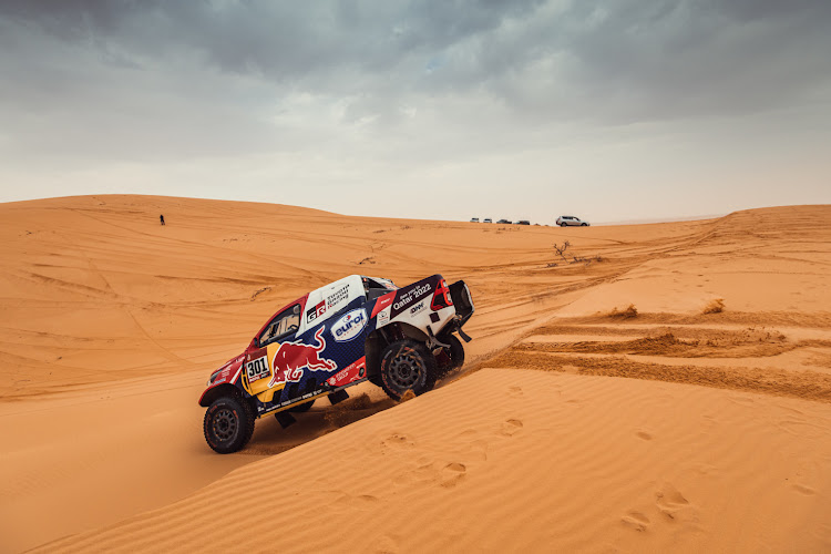 Nasser al-Attiyah and navigator Mathieu Baumel blast through the dunes en route to a stage eight victory.