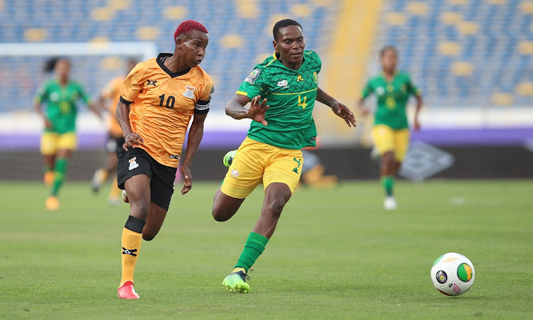 Grace Chanda of Zambia is challenged by Noko Matlou of SA during the 2022 Women's Africa Cup of Nations semifinal at Stade Mohammed V in Casablanca, Morocco, on July 18 2022.