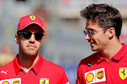 Undertain future: Sebastian Vettel (left) with Ferrari teammate Charles Leclerc.