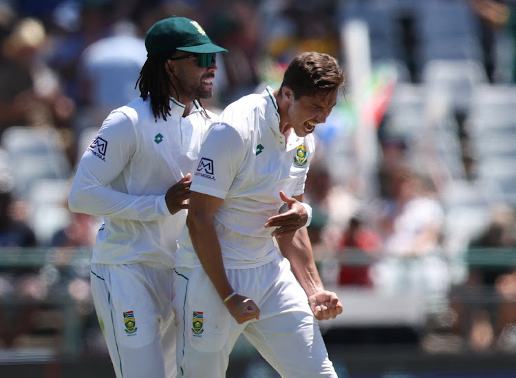 South Africa's Nandre Burger celebrates with Tony de Zorzi after taking the wicket of India's Shubman Gill on day one of the second Test at Newlands on Wednesday.