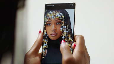 A high quality photo of a Black woman appears on a Pixel phone screen