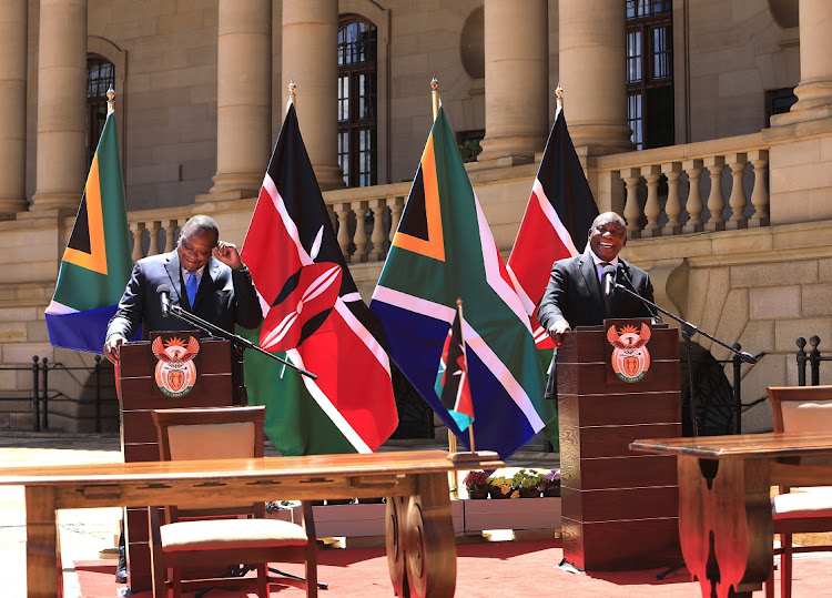 President Cyril Ramaphosa hosts Kenyan counterpart Uhuru Kenyatta, left, on a state visit at the Union Buildings in Tshwane on Tuesday.