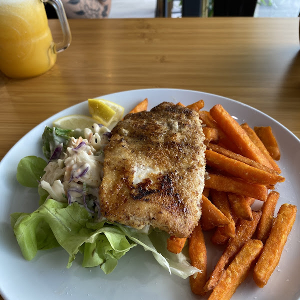 Gf Almond coated chicken schnitzel with sweet potato chips and coleslaw