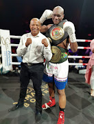 Promoter Lebo Mahoko and newly crowned SA and WBA Pan African middleweight champion Nkululeko Mhlongo celebrate their victory against Walter Dlamini.