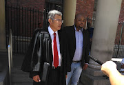 Hlumelo Biko with his lawyer, Roy Barendse, outside Cape Town Magistrate’s Court on Thursday, 04 January 2018.