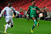 Siyabonga Nomvete of Amazulu FC keeps the ball from Zitha Macheke of Chippa United during the Absa Premiership 2017/18 game between Chippa United and Amazulu at Nelson Mandela Bay Stadium in Port Elizabeth.