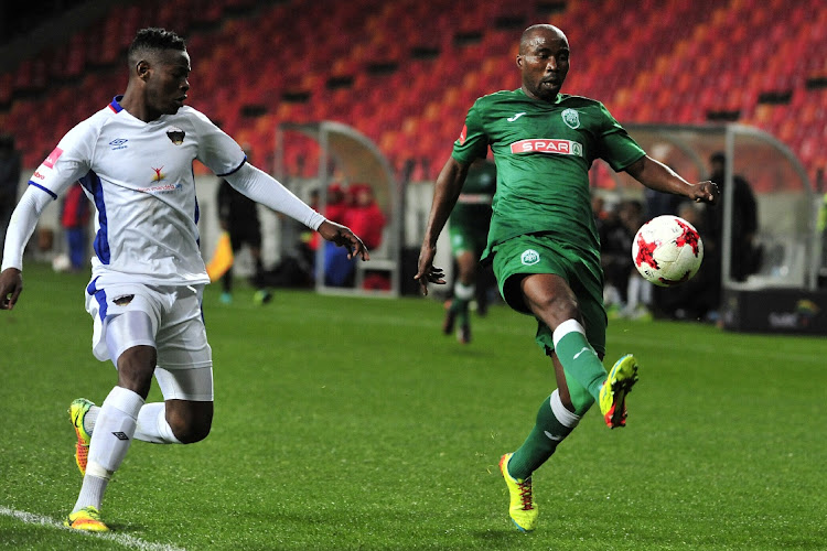 Siyabonga Nomvete of Amazulu FC keeps the ball from Zitha Macheke of Chippa United during the Absa Premiership 2017/18 game between Chippa United and Amazulu at Nelson Mandela Bay Stadium in Port Elizabeth.