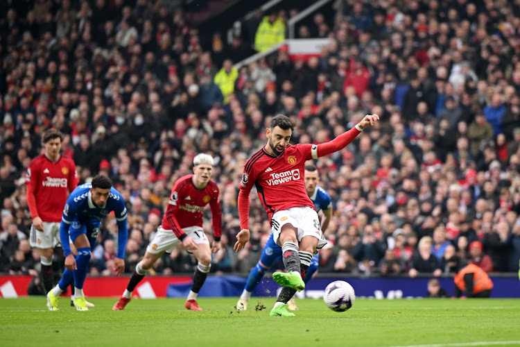 Bruno Fernandes of Manchester United scores his team's first goal from the penalty spot during the Premier League match against Everton FC at Old Trafford on Saturday.