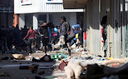 Demonstrators loot stores as protests continue on July 12 2021.