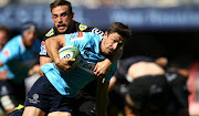 Keegan Daniel of the Cell C Sharks looks to stop Jake Gordon of the Waratahs over for a try during the Super Rugby match between Cell C Sharks and Waratahs at Kings Park on March 03, 2018 in Durban. 
