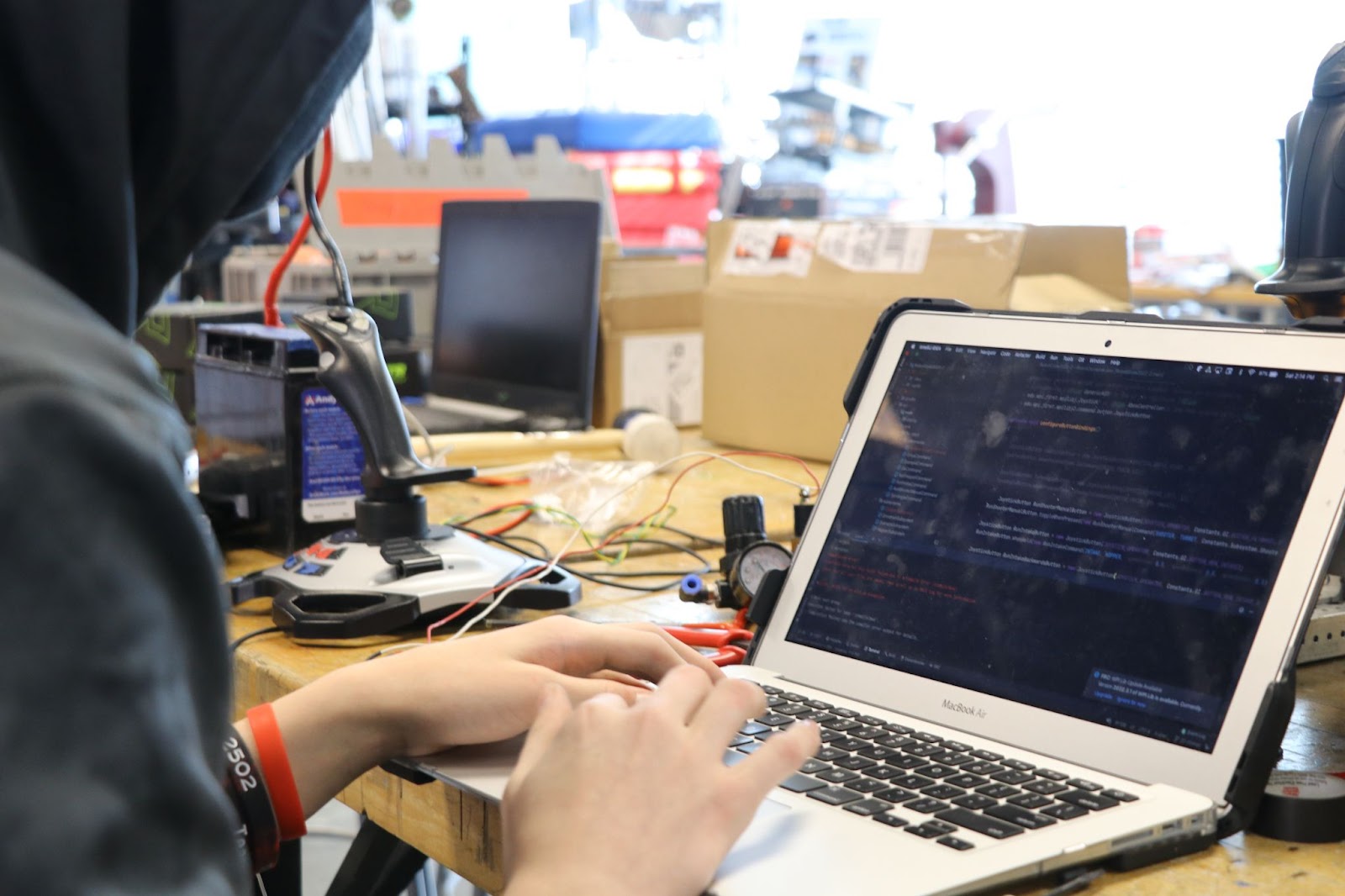 A team member pushing new code onto the robot.