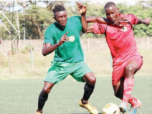 Buruburu Sports’ Glen Ochieng (L)battles for the ball with Soita Silicho of Nairobi County in a recnt match of the ongoing Governor’s Cup. /COURTESY