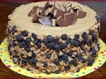 REESE'S OVERLOAD CAKE-2 PEANUT BUTTER BLONDIE LAYERS, 1 CHOCOLATE CHEESECAKE LAYER FILLED WITH AN INTENSE CHOCOLATE FROSTING, TOPPED WITH PB FROSTING was pinched from <a href="http://www.hugsandcookiesxoxo.com/2012/08/reeses-overload-cake-2-peanut-butter.html" target="_blank">www.hugsandcookiesxoxo.com.</a>