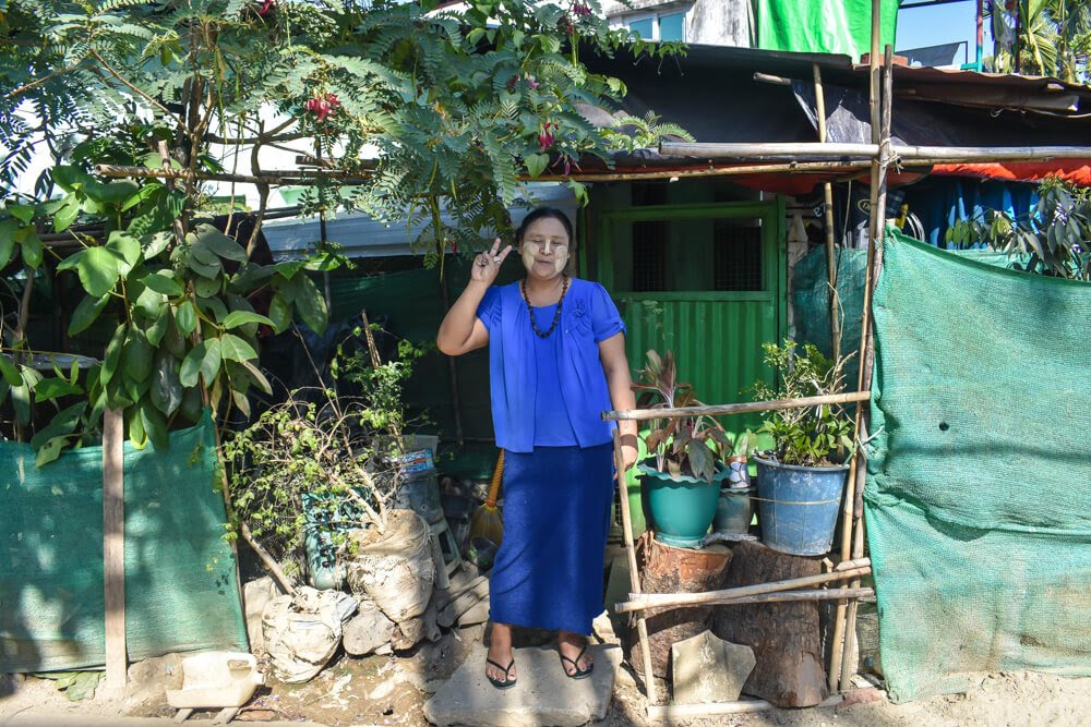 burmese woman with thanaka on her face in mingaladon