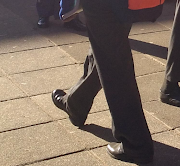 A Hoërskool Pretoria-Wes student wears standard school pants.