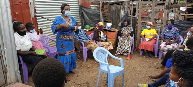 Karamaro Seed Savers Self Help Group chairperson, Rachel Wanjira training farmers on seed saving at Langa Langa area of Gilgil Sub-County in Nakuru.