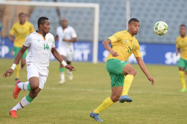 Soulaimana Malaga of Comoros and Ashley Cupido of South Africa during the 2022 African Nations Championship qualifier match at Dobsonville Stadium on July 30 in Johannesburg.