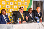 Danny Jordaan (President) of SAFA with Dr Thulani Ngwenya, Gaye Mokoena (acting CEO) and an executive member of SAFA as they announce cancellation of all football in South Africa during the SAFA press conference at SAFA House on March 18, 2020 in Johannesburg, South Africa. 