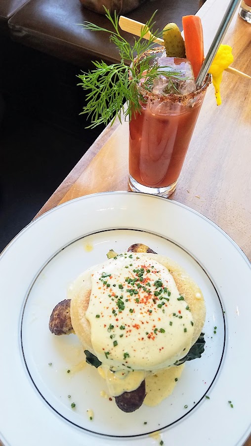 Brunch at St. Jack's: egg sandwich with foie gras boudin, cheddar, braised greens, bearnaise on an english muffin.