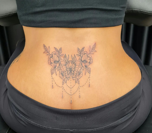 Butterfly With Ornaments Lower Back Tattoo