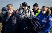 The International Space Station (ISS) crew member NASA astronaut Mark Vande Hei is carried to a medical tent shortly after landing with the Soyuz MS-19 space capsule in a remote area outside Zhezkazgan, Kazakhstan March 30, 2022.