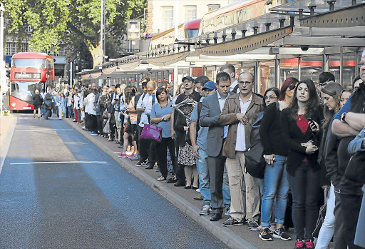 EARLY-MORNING MISERY: Commuters who usually get to work in minutes on the efficient underground railway are forced to queue for buses at Victoria Station, in London, yesterday as a 24-hour strike by staff and drivers brought the British capital’s network to a standstill Picture: REUTERS