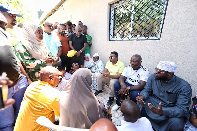 UDA vice chairman Hassan Omar, businesman Ali Kitaka and Sheikh Abu Qatada at Kuuza's family house in Bofu, Likoni on Sunday.