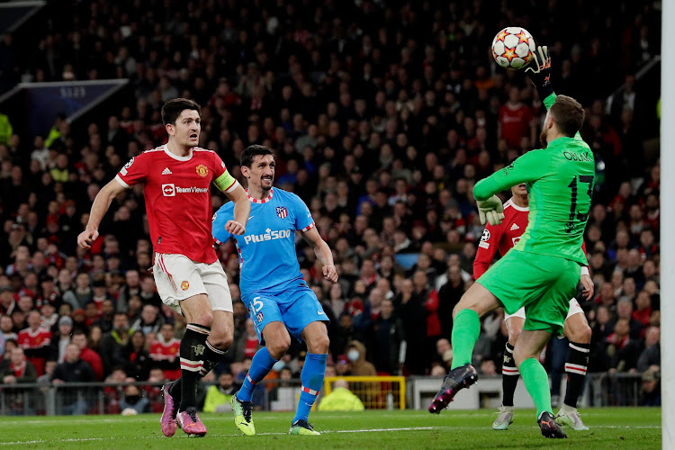 Atletico Madrid's keeper Jan Oblak makes a crucial save during the match.