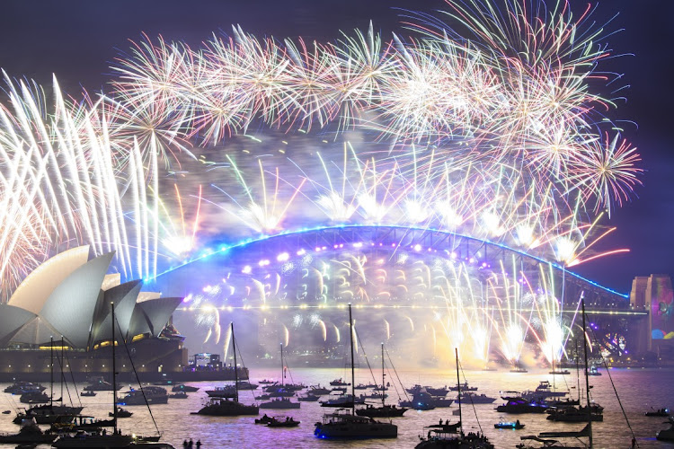 Fireworks are seen over Sydney harbour during New Year's Eve celebrations on January 1 2022 in Sydney, Australia. New Year's Eve celebrations continue to be somewhat different as some Covid-19 restrictions remain in place.