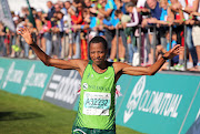 A file photo of four-time Olympican Hendrick Ramaala celebrating after finishing second in the men's Two Oceans Marathon in Cape Town in 2014.