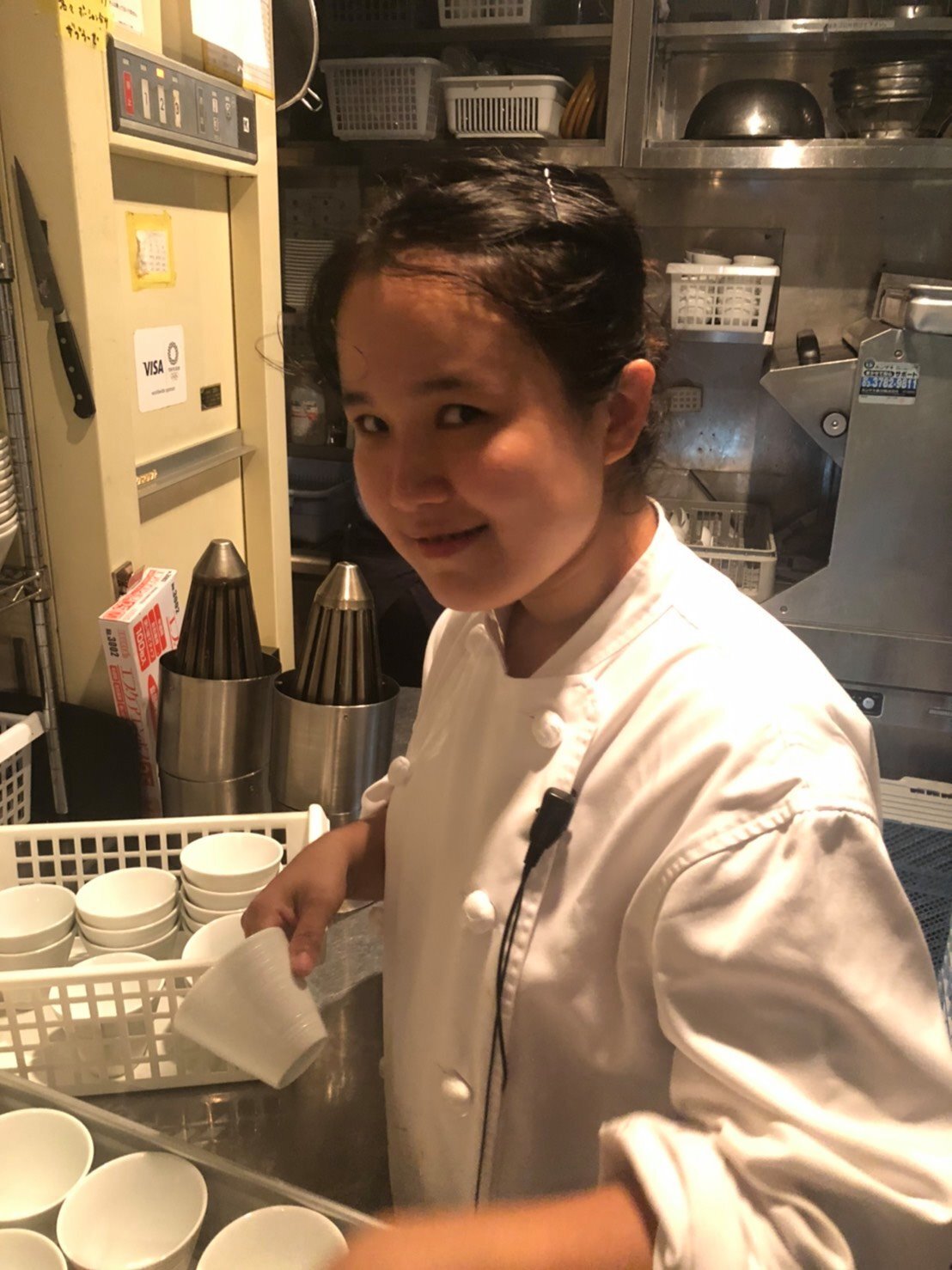 A woman working in a yakiniku restaurant in Japan.