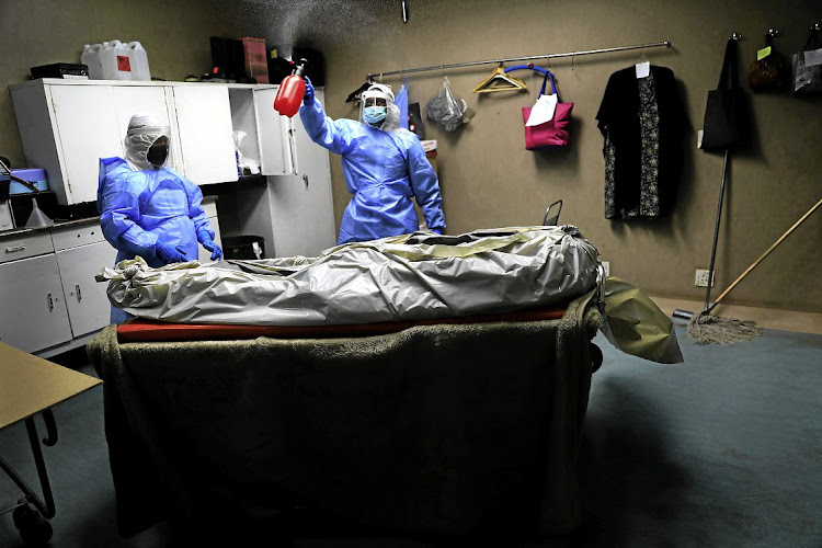A cadaver in a body bag is steralised in the embalming room of a Johannesburg funeral parlour during the Covid-19 pandemic. File photo.