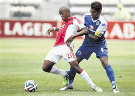 cape tango: Ajax Cape Town's Cecil Lolo fights for the ball with SuperSport United's Clayton Daniels during their Absa Premiership match at Athlone Stadium in Cape Town on Sunday Photo: Luke Walker/Gallo Images