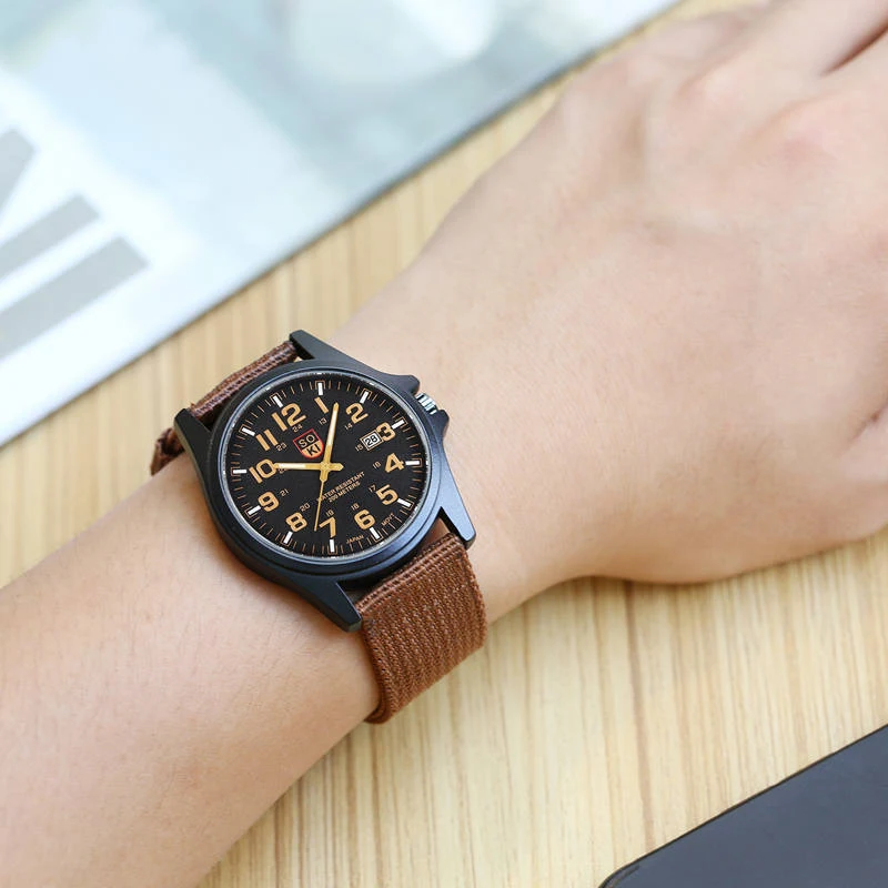 Montre homme sport quartz avec bracelet en nylon tressé et calendrier. Parfait pour le sport, le quotidien et le style.