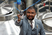 November 27 2016.  Teboho   Twala  with a sample of his Revo Premium Draught which is being brewed at a plant in Sasolburg, Free State. Pic. Antonio Muchave. © Sowetan.