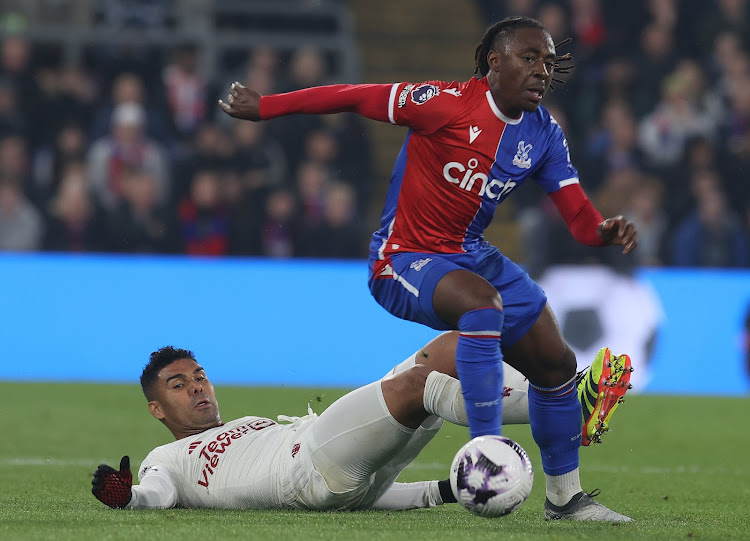 Manchester United's Casemiro vies for the ball with Crystal Palace Eberechi Eze